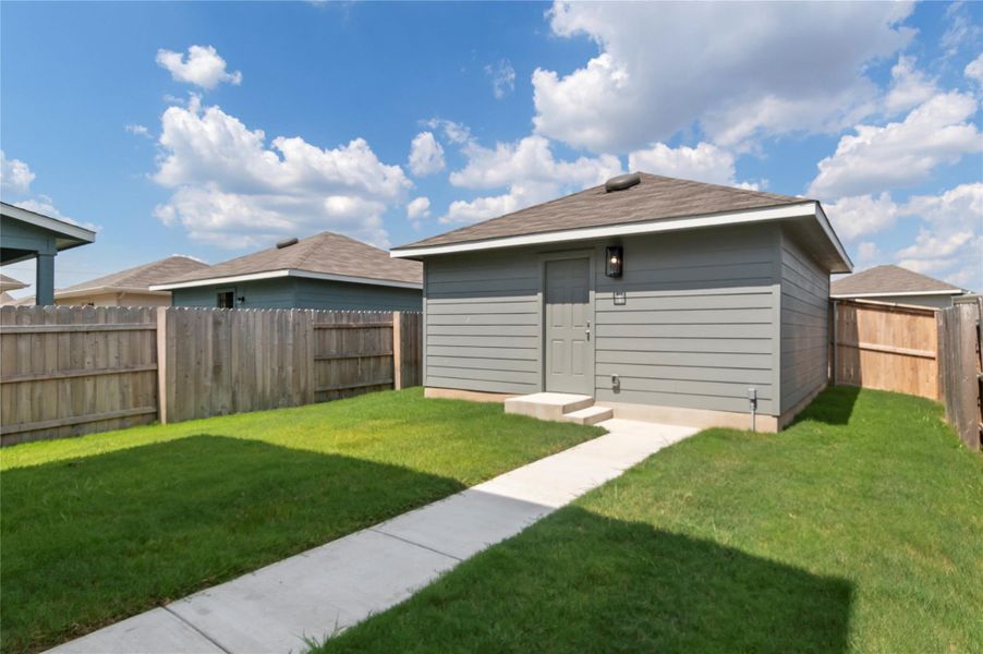 Rear view of property with a fenced backyard Rear view of property with a fenced backyard
