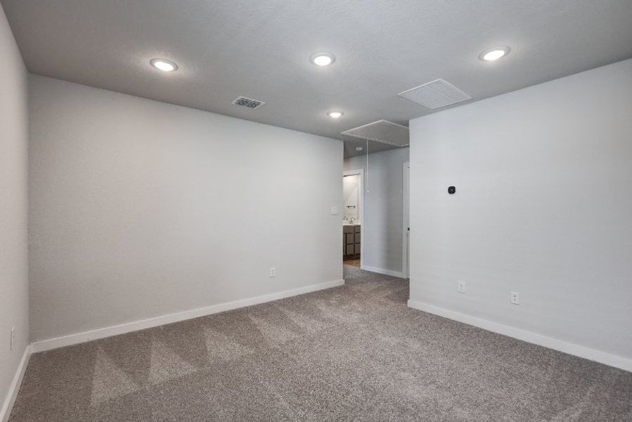 A hallway with white walls.