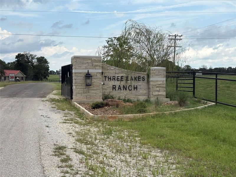 Community / neighborhood sign featuring driveway