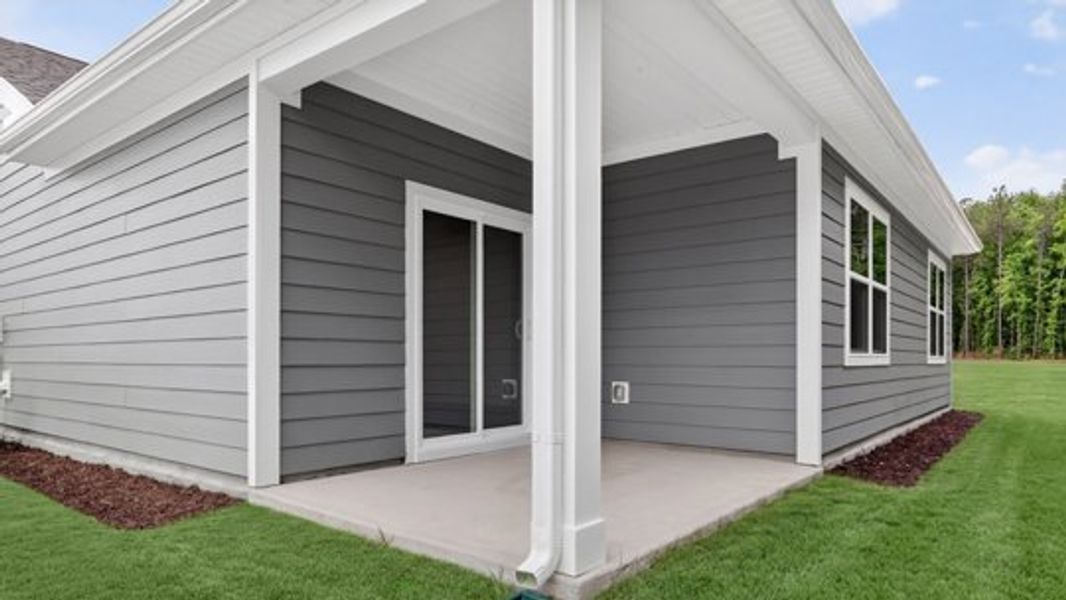 Exterior details and patio area of a home in East Ridge, Ayden (Image 4).