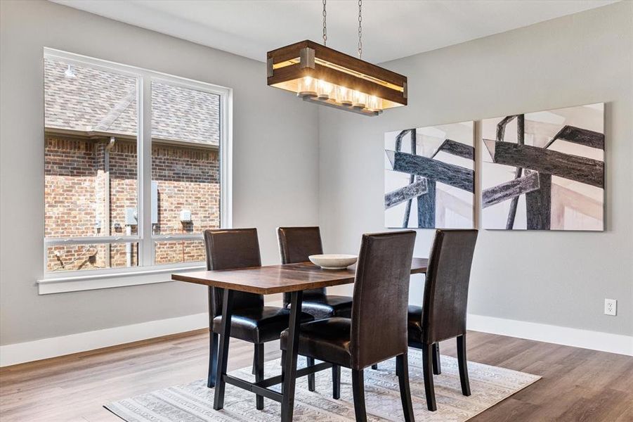 Dining space featuring light wood-type flooring and plenty of natural light