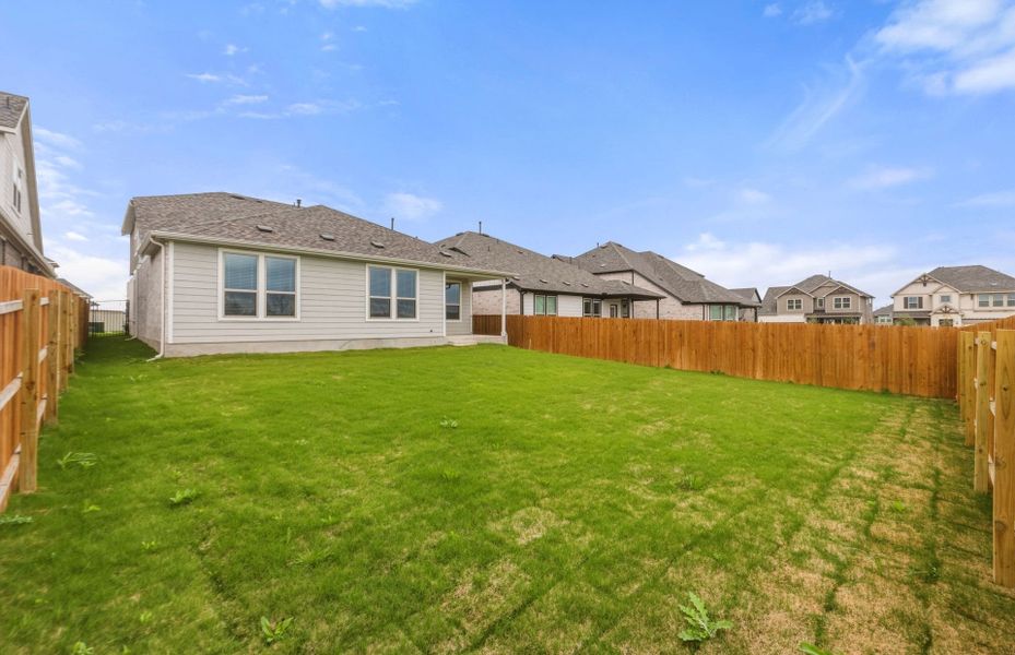 Exterior details and patio area of a home in Saddleback at Santa Rita Ranch, Liberty Hill (Image 29).