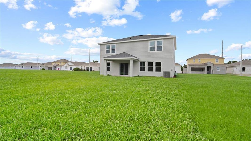 Front exterior of a new home in Willowbrook North, Winter Haven, FL, highlighting curb appeal (Image 2).