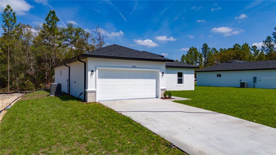 Front exterior of a new home in , Ocala, FL, highlighting curb appeal (Image 11).