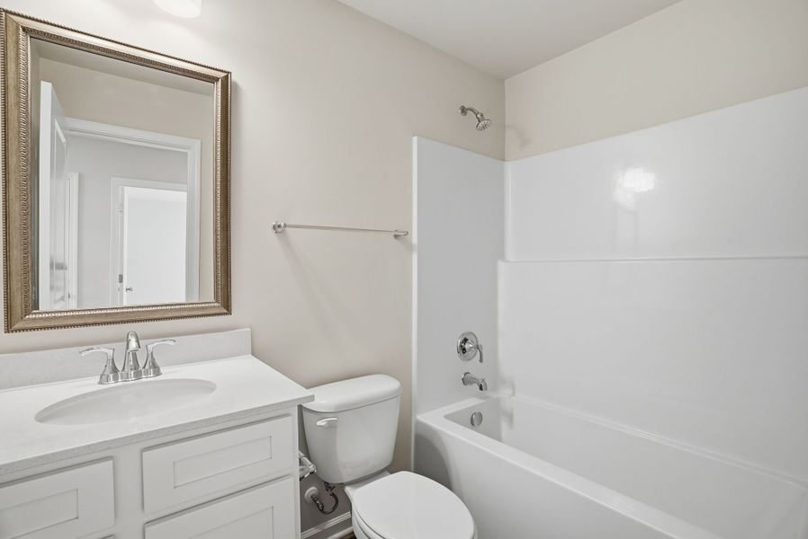 Representative furnished interior of a home built from the Juniper B by McGuinn Homes in Hunters Branch, Hopkins (Image 20).