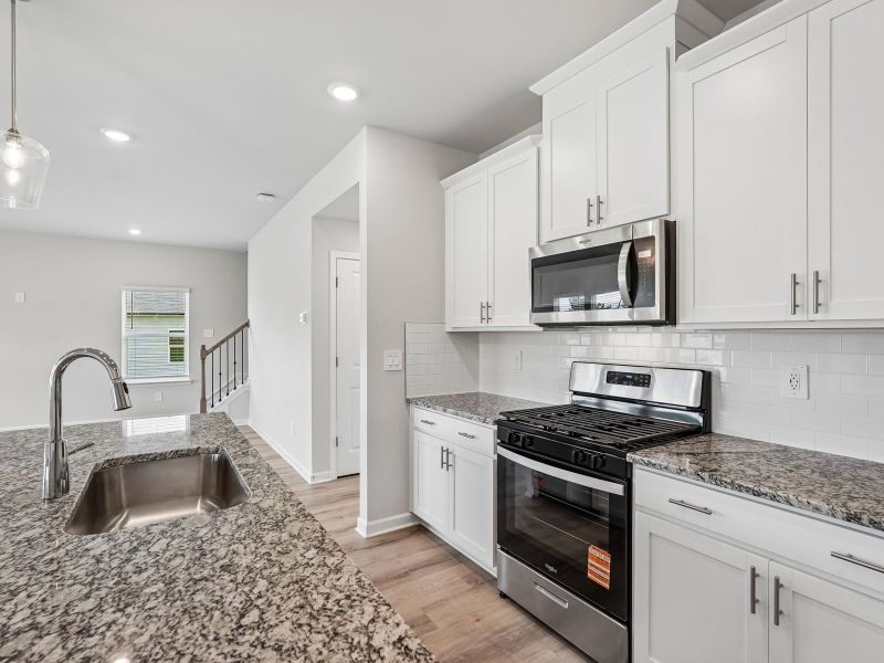Furnished interior view inside a new home in Northwoods at Mirror Lake, Villa Rica (Image 7).