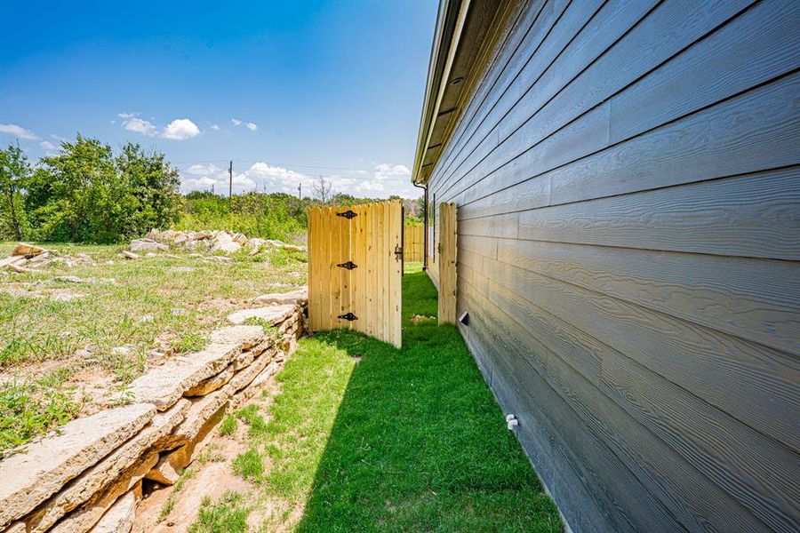 Side yard with gate entry