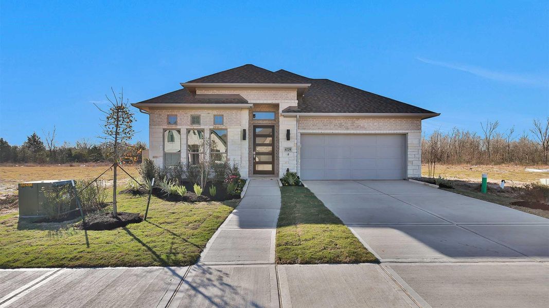 Front exterior of a new home in Legacy, League City, TX, highlighting curb appeal (Image 2).