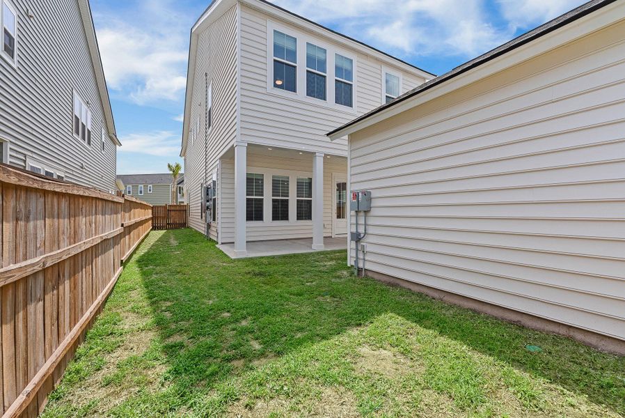 Exterior details and patio area of a home in Heron's Walk at Summers Corner, Summerville (Image 31).