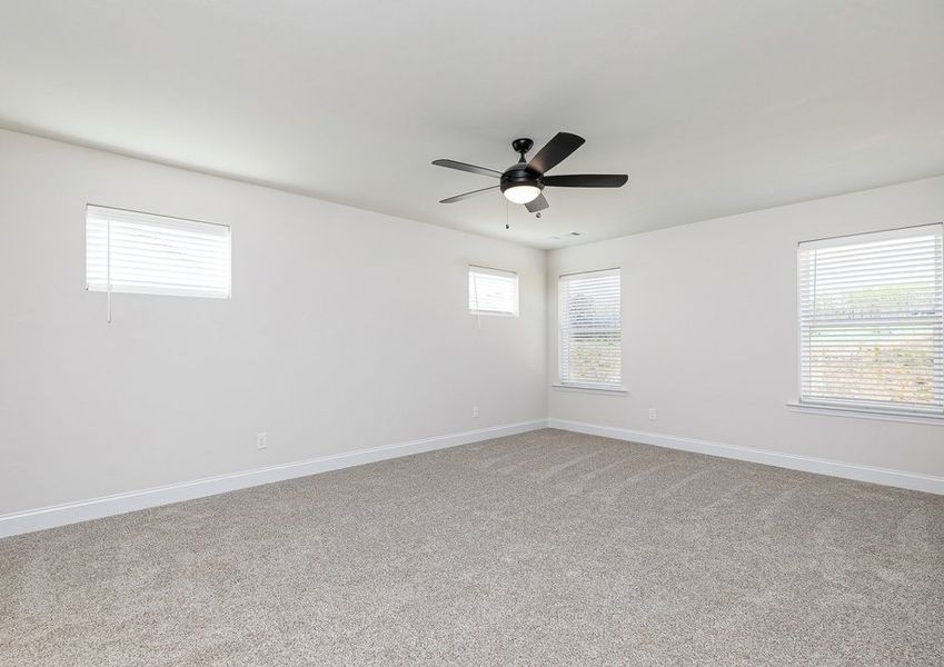 Rest and relaxation await in the master bedroom