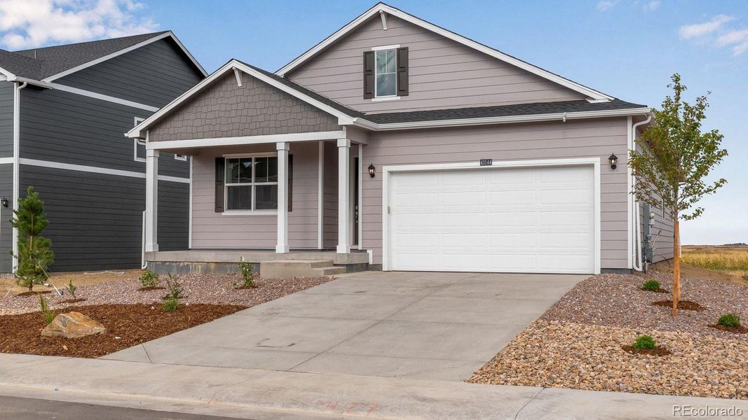 Front exterior of a new home in Spring Valley Ranch, Elizabeth, CO, highlighting curb appeal (Image 20). Front exterior of a new home in Spring Valley Ranch, Elizabeth, CO, highlighting curb appeal (Image 20).