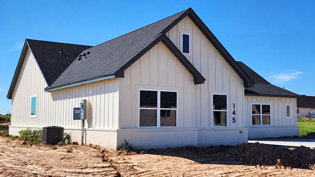 Front exterior of a new home in Stagecoach Crossing, Bridgeport, TX, highlighting curb appeal (Image 10). Front exterior of a new home in Stagecoach Crossing, Bridgeport, TX, highlighting curb appeal (Image 10).