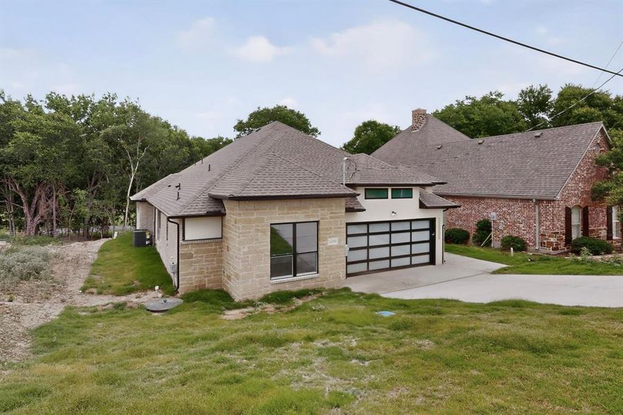 Front exterior of a new home in , Whitney, TX, highlighting curb appeal (Image 2). Front exterior of a new home in , Whitney, TX, highlighting curb appeal (Image 2).
