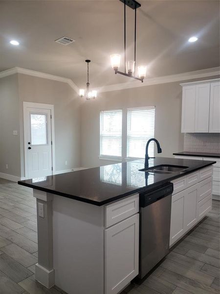 Kitchen island open to dining and living areas