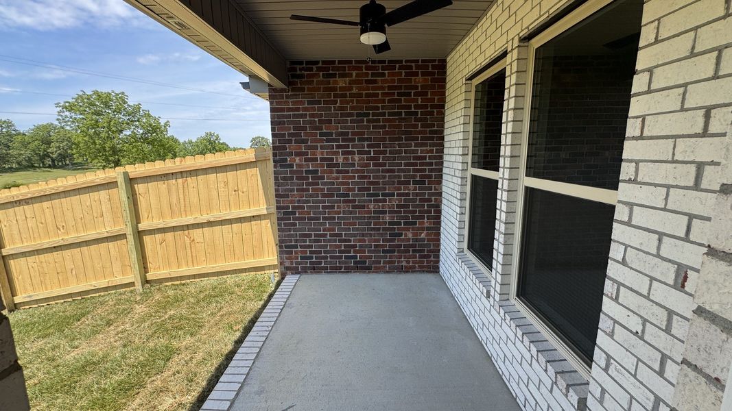 Exterior details and patio area of a home in The Greens at Legacy Townhomes, Springfield (Image 3).