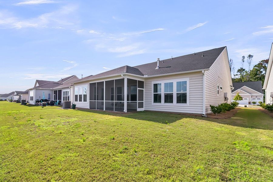 Front exterior of a new home in Horizons at Summers Corner | 55+: The Legends, Summerville, SC, highlighting curb appeal (Image 24).