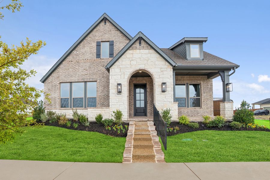 Front exterior of a new home in Talia – Garden Series, Mesquite, TX, highlighting curb appeal (Image 1). Front exterior of a new home in Talia – Garden Series, Mesquite, TX, highlighting curb appeal (Image 1).