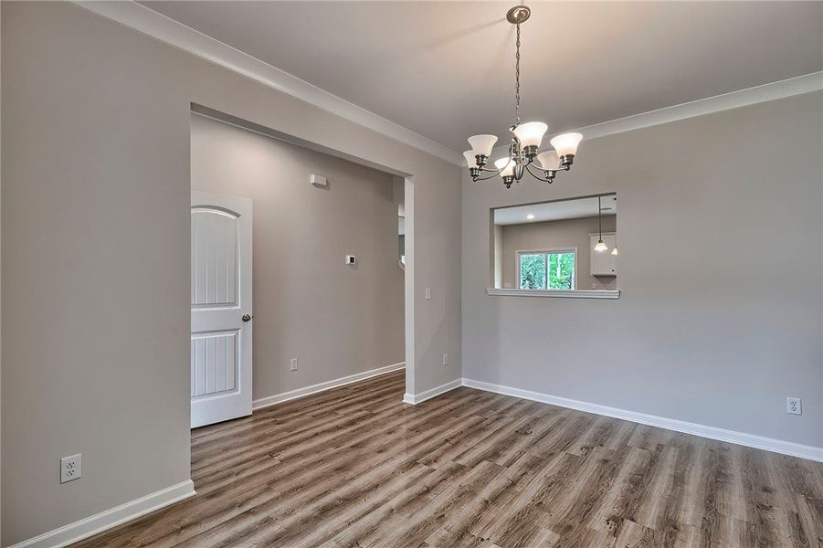 This versatile dining space offers crown molding a