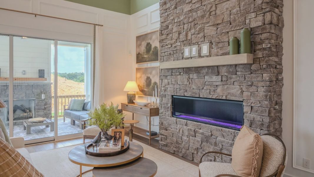 Gathering room with fireplace and access to rear porch Gathering room with fireplace and access to rear porch