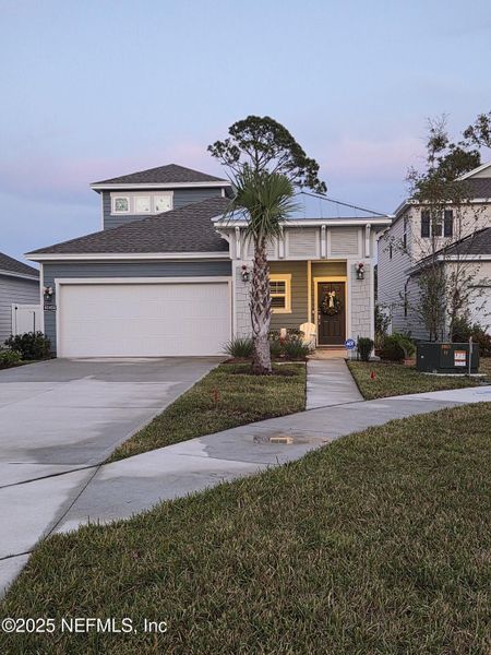 Front exterior of a new home in Condo Collection at Grand Vue at Interlocken, Fernandina Beach, FL, highlighting curb appeal (Image 24).