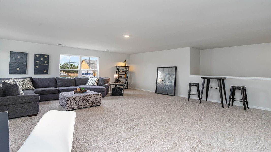 Representative furnished interior of a home built from the TILLMAN by D.R. Horton in Spring View Landing, Loris (Image 21).