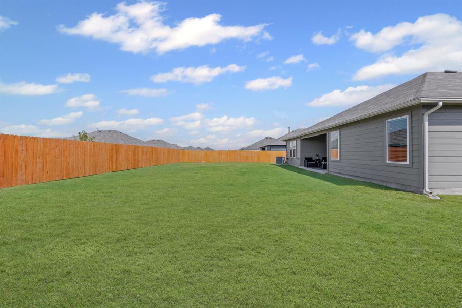 Front exterior of a new home in Hartland Ranch, Lockhart, TX, highlighting curb appeal (Image 2). Front exterior of a new home in Hartland Ranch, Lockhart, TX, highlighting curb appeal (Image 2).