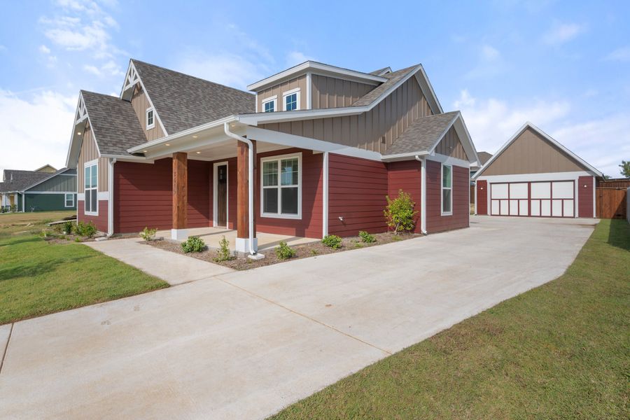 Front exterior of a new home in Heritage Towne, Midlothian, TX, highlighting curb appeal (Image 23). Front exterior of a new home in Heritage Towne, Midlothian, TX, highlighting curb appeal (Image 23).