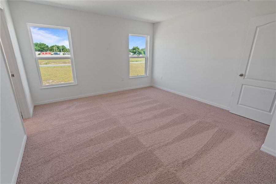 Spacious, unfurnished interior of a new home in Peach Crossings, Winter Haven (Image 12).