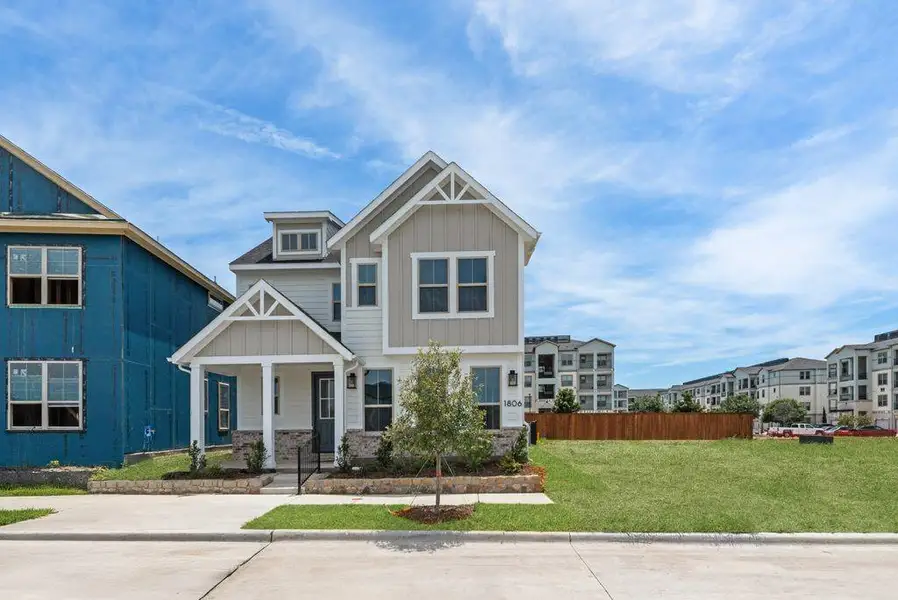 Front exterior of a new home in Bayside, Rowlett, TX, highlighting curb appeal (Image 2). Front exterior of a new home in Bayside, Rowlett, TX, highlighting curb appeal (Image 2).