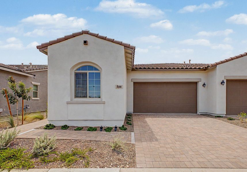Front exterior of a new home in Mira Vista at Victory, Buckeye, AZ, highlighting curb appeal (Image 1). Front exterior of a new home in Mira Vista at Victory, Buckeye, AZ, highlighting curb appeal (Image 1).