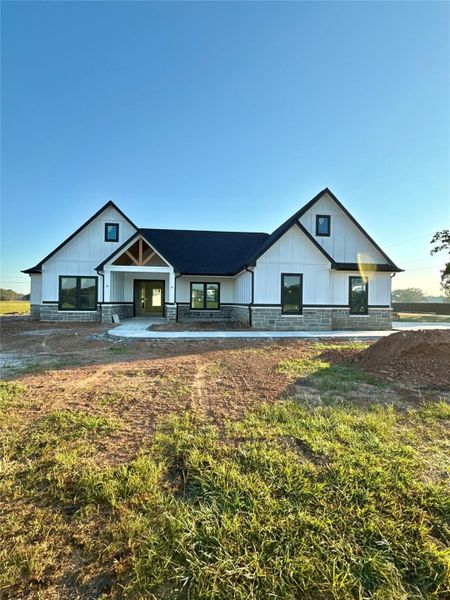 Front exterior of a new home in , Angleton, TX, highlighting curb appeal (Image 11).