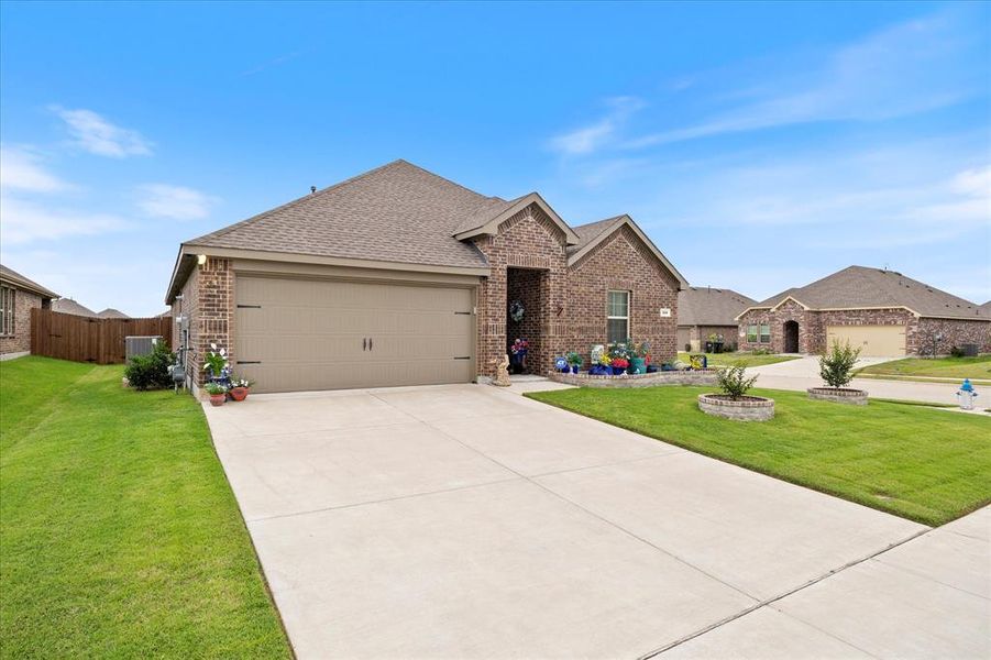 Front exterior of a new home in , Caddo Mills, TX, highlighting curb appeal (Image 24).