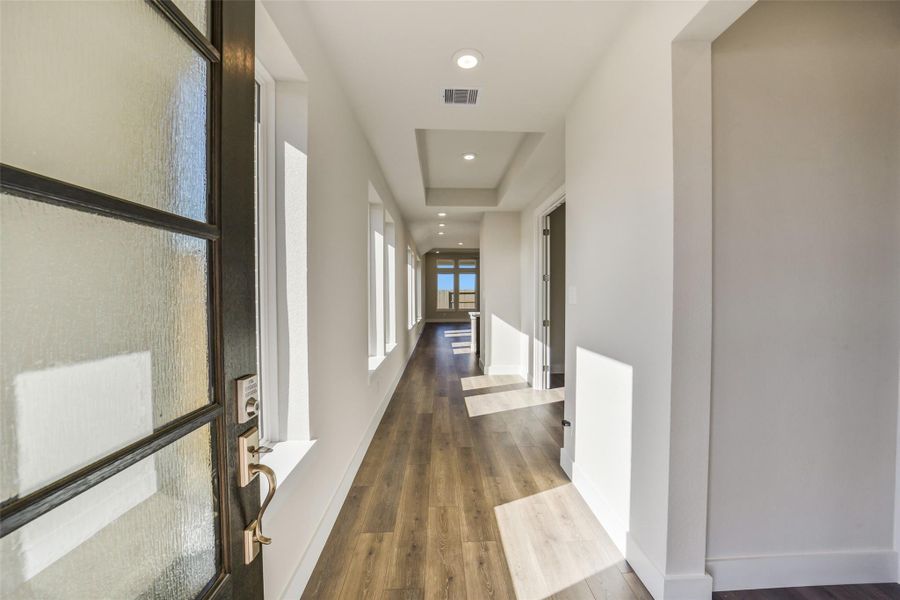 Spacious, unfurnished interior of a new home in Sunterra, Katy (Image 27).