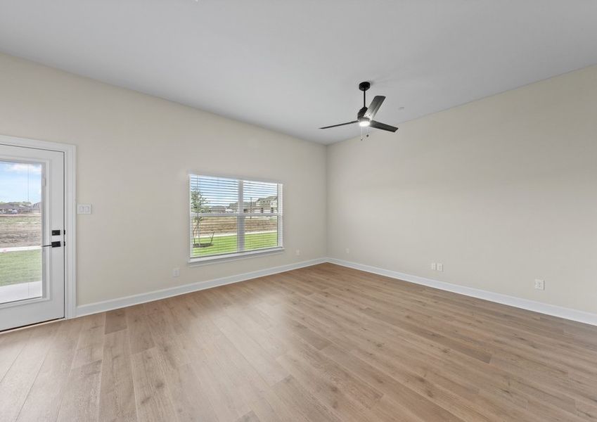 The family room has a large window that lets in great, natural light.