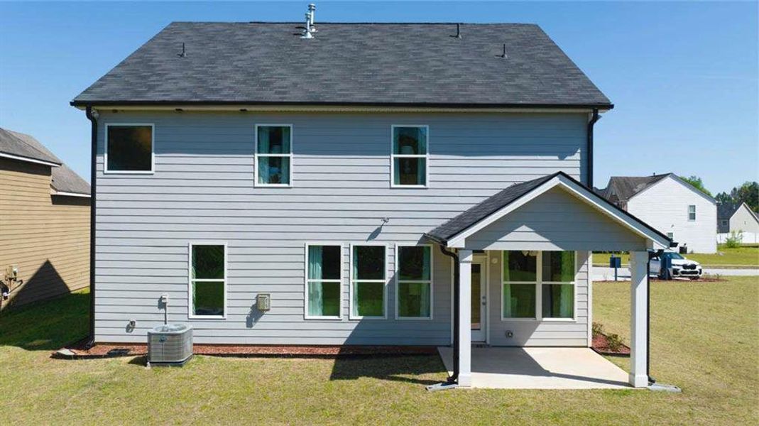 Exterior details and patio area of a home in Wildwood, Covington (Image 2). Exterior details and patio area of a home in Wildwood, Covington (Image 2).