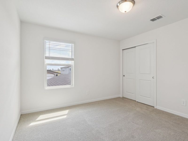 Spacious, unfurnished interior of a new home in The Reserve at Hammock Oaks - Classic Series, Lady Lake (Image 11).