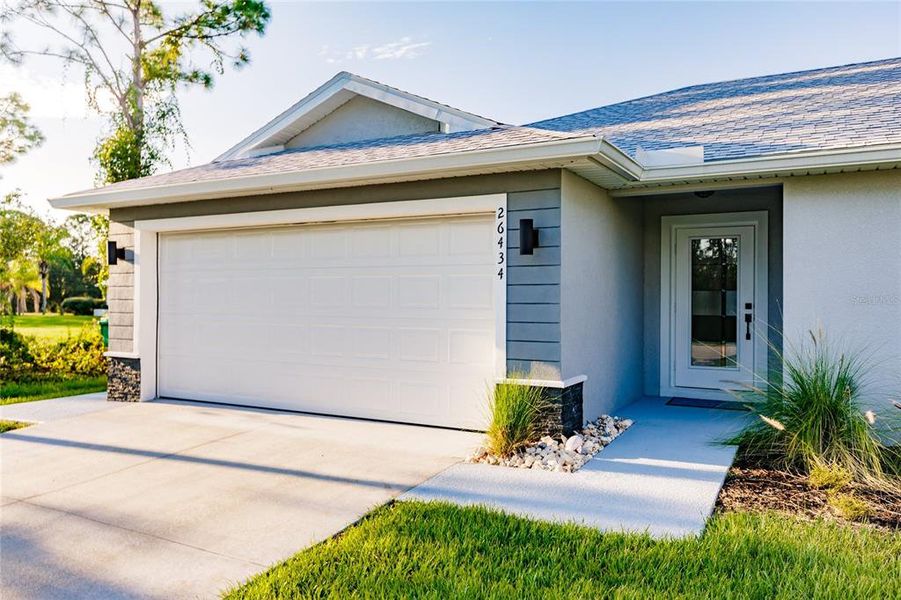 Front exterior of a new home in , Cape Coral, FL, highlighting curb appeal (Image 24).