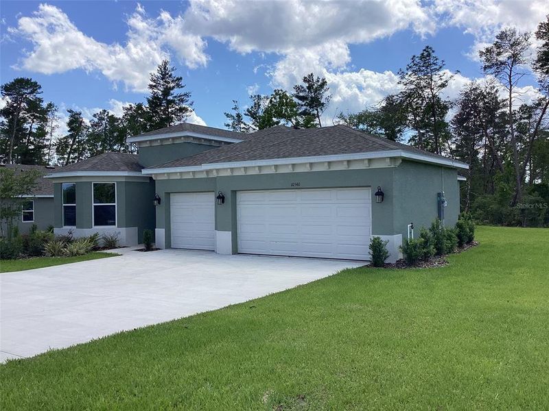 Front exterior of a new home in , Ocala, FL, highlighting curb appeal (Image 28).
