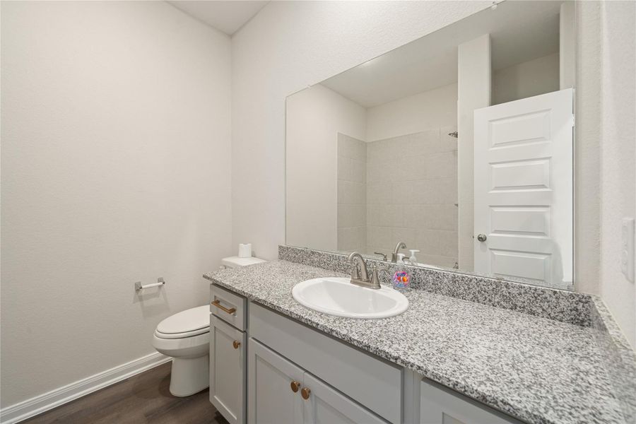 his beautifully finished bathroom features a double-sink vanity, walk-in glass shower, and sleek neutral tones throughout. Its clean lines and bright design create a calming, spa-inspired retreat. his beautifully finished bathroom features a double-sink vanity, walk-in glass shower, and sleek neutral tones throughout. Its clean lines and bright design create a calming, spa-inspired retreat.