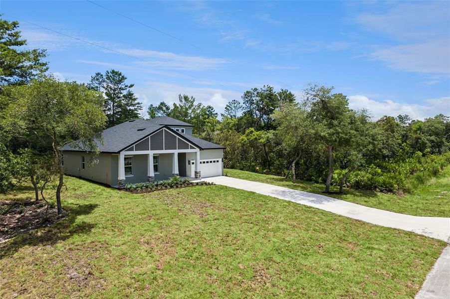 Front exterior of a new home in , Eustis, FL, highlighting curb appeal (Image 2). Front exterior of a new home in , Eustis, FL, highlighting curb appeal (Image 2).