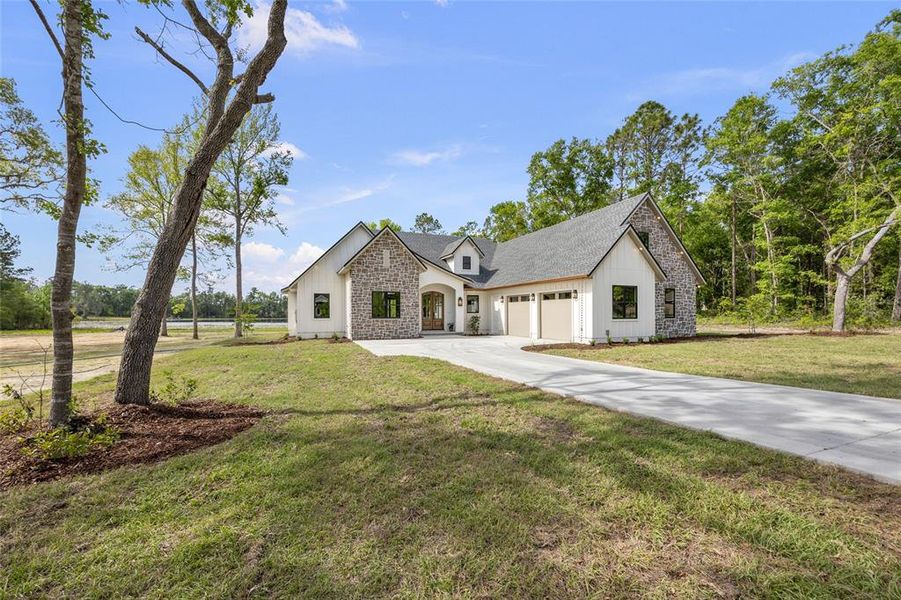 Front exterior of a new home in , Lake City, FL, highlighting curb appeal (Image 1).