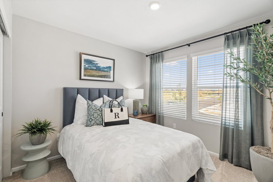 Representative furnished interior of a home built from the 2403 by Risewell Homes in Harvest Crossing, Aurora (Image 25).