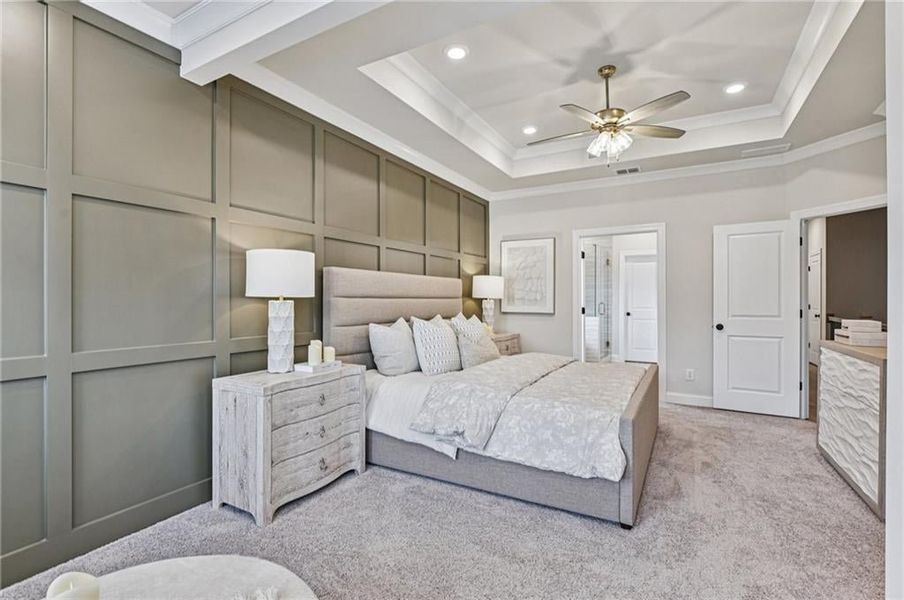 Bedroom featuring a decorative wall, carpet flooring, ceiling fan, recessed lighting, and crown molding