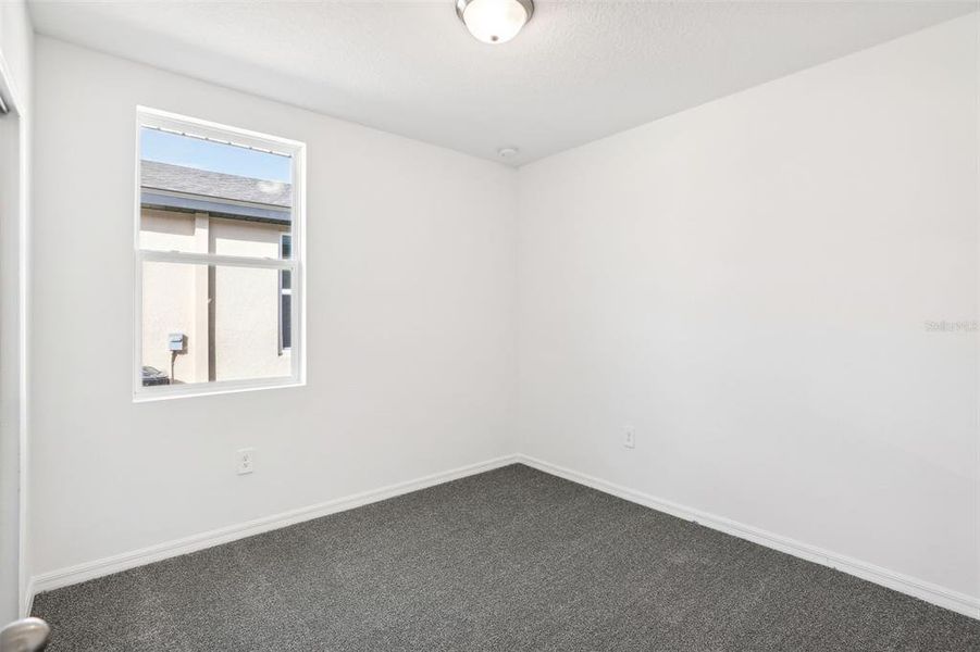 Spacious, unfurnished interior of a new home in Lake Deer Estates - Classic Series, Poinciana (Image 12).