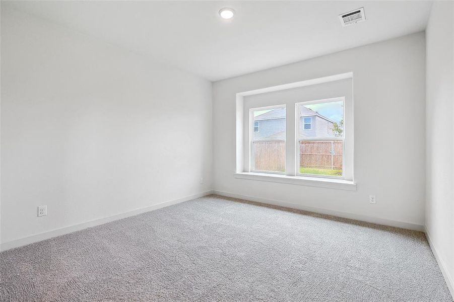 Unfurnished room with carpet