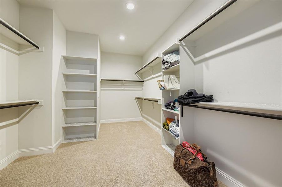 Walk in closet with light carpet Walk in closet with light carpet
