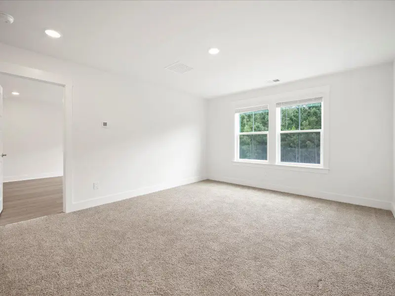 Spacious, unfurnished interior of a new home in The Coves at Lakes of Cane Bay, Summerville (Image 30). Spacious, unfurnished interior of a new home in The Coves at Lakes of Cane Bay, Summerville (Image 30).