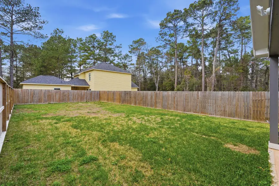 Exterior details and patio area of a home in , Conroe (Image 4).