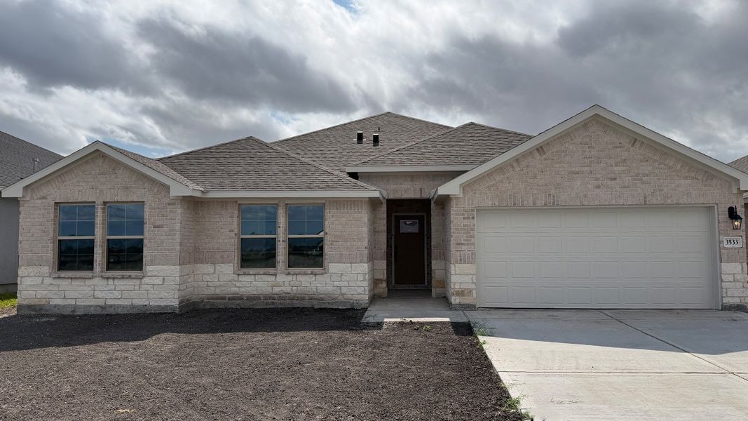 Front exterior of a new home in The Lakes Northwest, Robstown, TX, highlighting curb appeal (Image 1). Front exterior of a new home in The Lakes Northwest, Robstown, TX, highlighting curb appeal (Image 1).