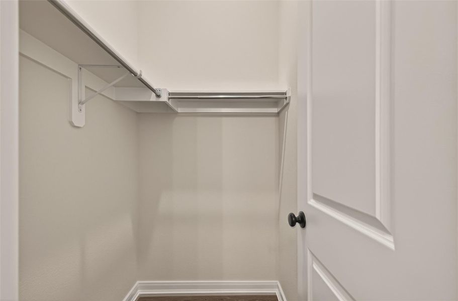 Guest bedroom walk-in closet.